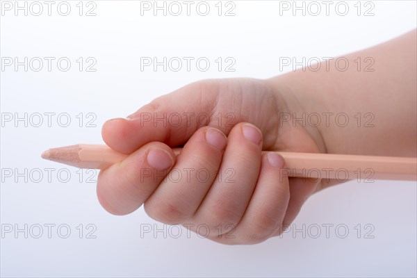 Hand holding a color pencil on a white background