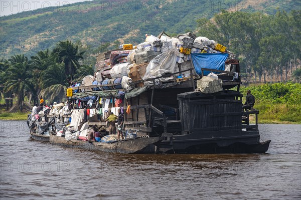 Overloaded riverboat on the Congo river