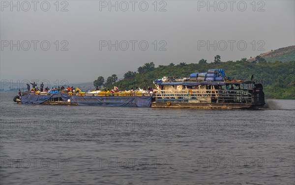 Overloaded riverboat on the Congo river