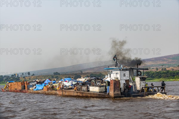 Overloaded riverboat on the Congo river