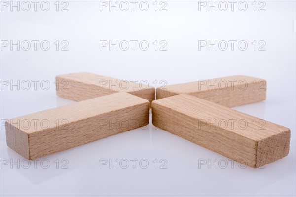 Wooden domino pieces positioned on white background