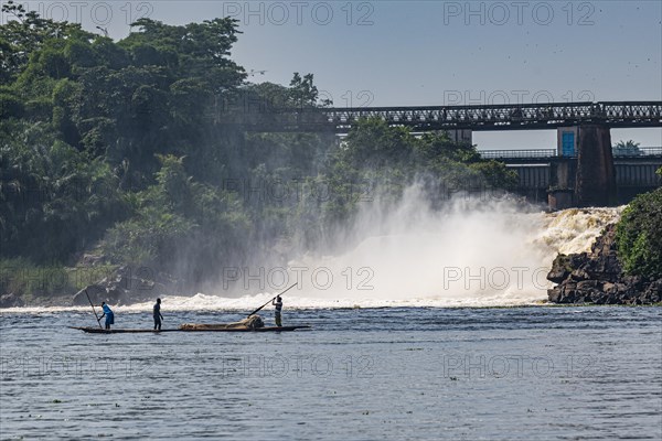 Fishermen fishing below the rapids on the Tshopo river