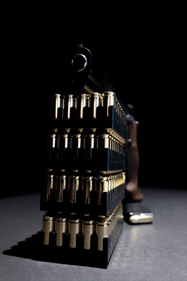 Elegant Semiautomatic 9mm Handgun Leaning on Bullet Ammunition in Switzerland