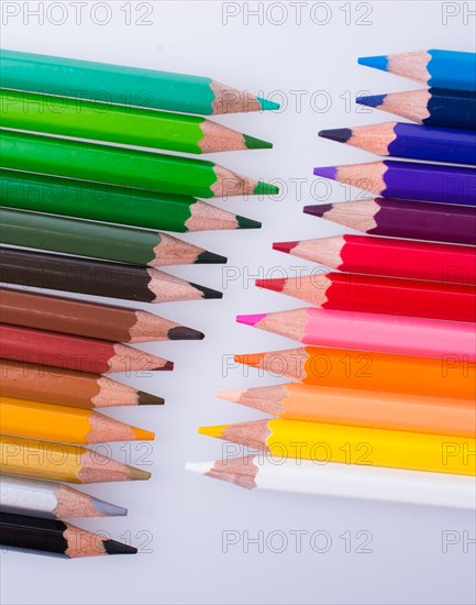 Color Pencils of Various colors placed on white background