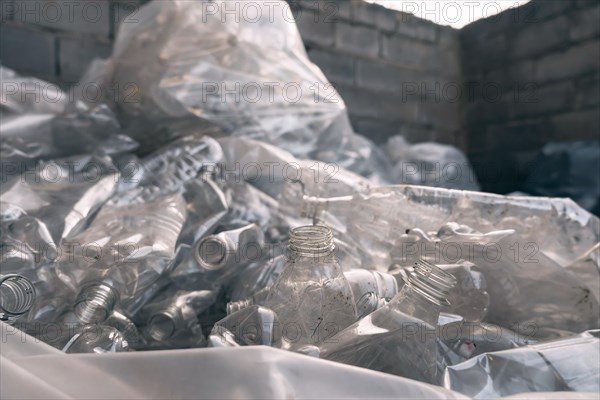 Transparent bags filled with plastic bottles for recycling