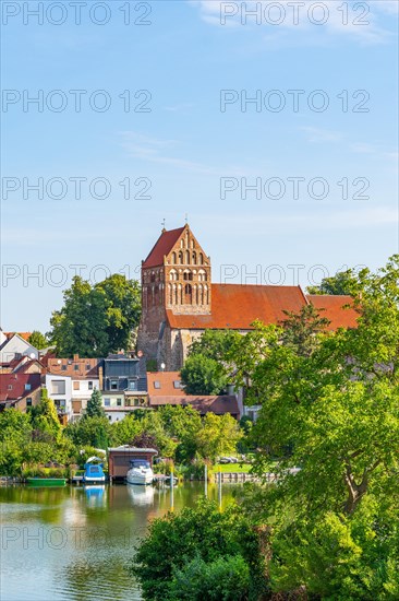 View over the town lake of Lychen to the town church of St. John