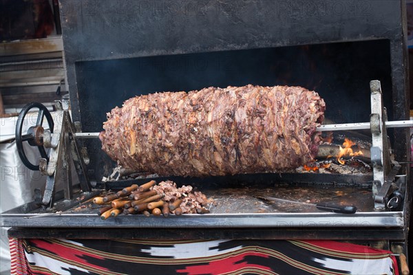 Turkish cag Kebab on pole in horizontal position