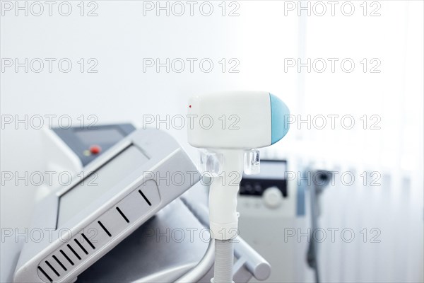 Close up of an adjusting machine for photorejuvenation or laser hair removal while waiting for next customer in spa parlor