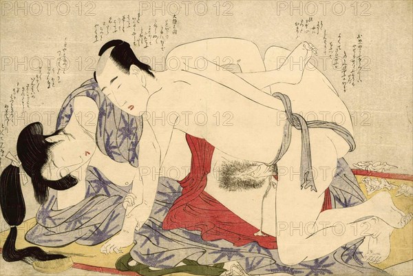 Young couple making love on a summer sleeping mat