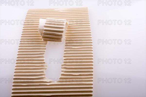 Rolled up torn paper on a white background