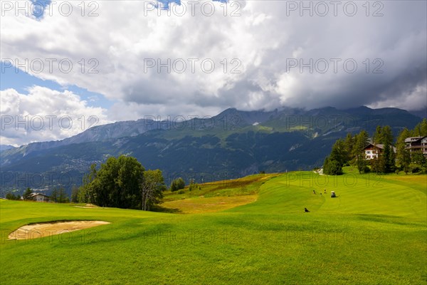 Crans Sur Sierre Golf Course with Hole 7 and Mountain View in Crans Montana in Valais