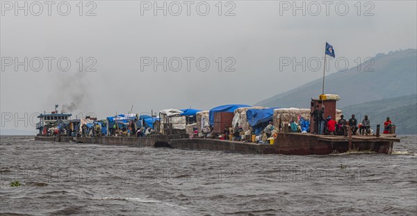 Overloaded riverboat on the Congo river