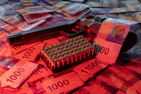 Elegant Semiautomatic 9mm Handgun with Swiss Helvetia Symbol Leaning on Swiss Franc 1000 Banknote and Bullet Ammunition in Switzerland