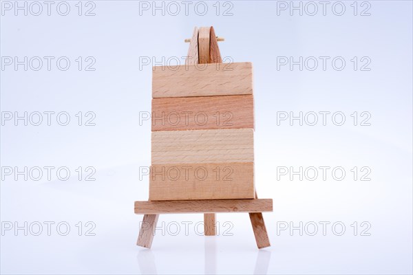 Building blocks put on tripod for painting on white background