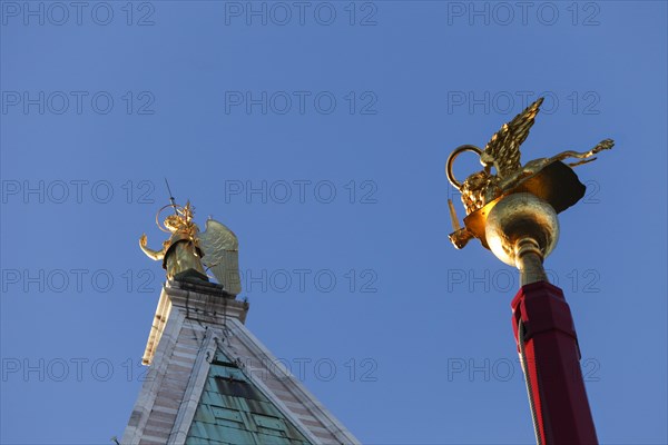Campanile with the gilded Archangel Gabriel and flagpole with St Mark's lions on the Piiazza San Marco