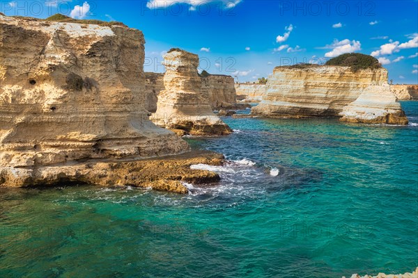 Rock stacks and crystal clear sea of the Faraglioni di Sant Andrea