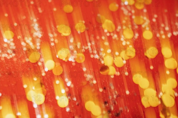 Red tone blurs the bokeh light. Defocused Red and orange holiday bokeh. Abstract christmas background