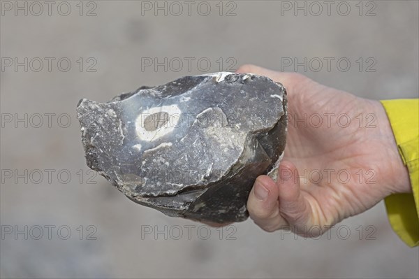 Woman holding flint