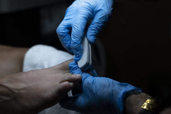 Woman Making Pedicure on Her Foot in Switzerland