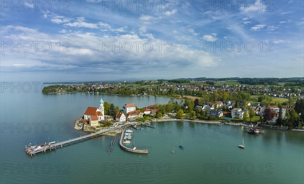 Aerial panorama of the moated castle peninsula on Lake Constance with the baroque church of St. George