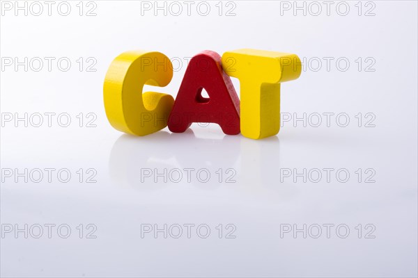 The word CAT written with colorful letter blocks