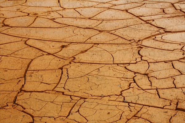 Ochre alluvial basin in the rain