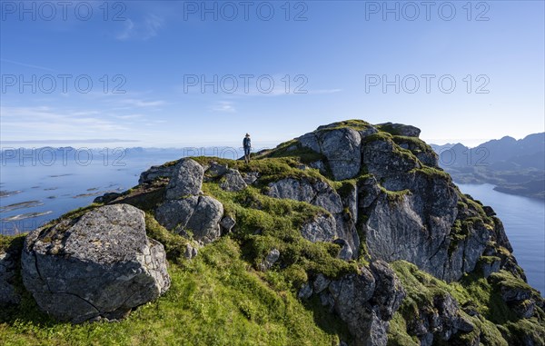 Hikers at the top of Dronningsvarden or Stortinden