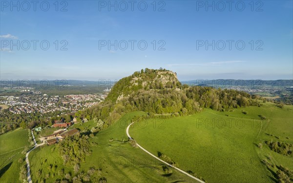 The volcanic cone Hohentwiel with the castle ruins illuminated by the evening sun