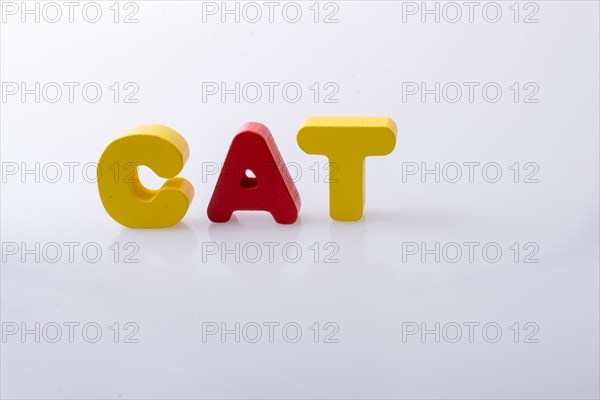 The word CAT written with colorful letter blocks