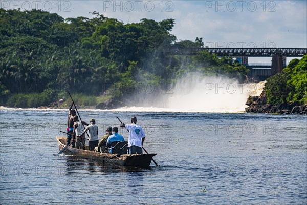 Fishermen fishing below the rapids on the Tshopo river