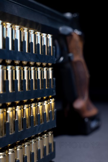 Elegant Semiautomatic 9mm Handgun Leaning on Bullet Ammunition in Switzerland