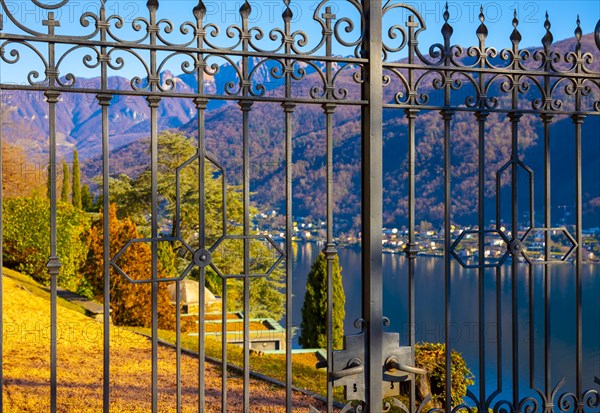 Metal Gate to Church Santa Maria del Sasso Against Blue Clear Sky on Mountain in a Sunny Day in Morcote