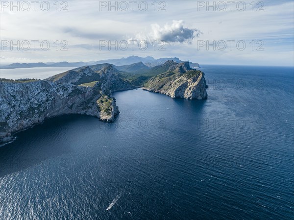 Flight past rocky cliffs and sea