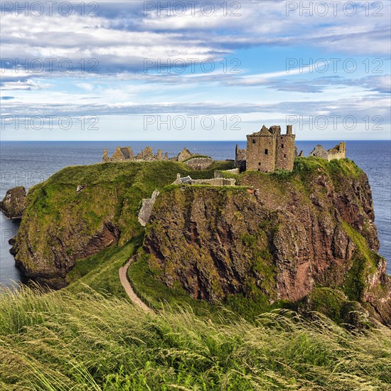 Rocky headland with castle ruins