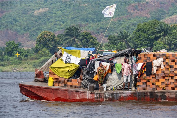 Overloaded riverboat on the Congo river