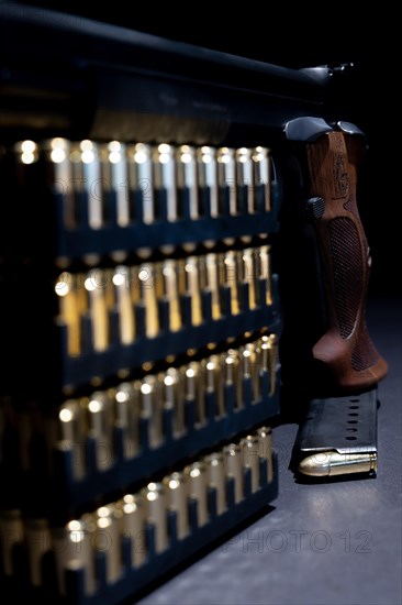 Elegant Semiautomatic 9mm Handgun with Swiss Helvetia Symbol Leaning on Bullet Ammunition in Switzerland