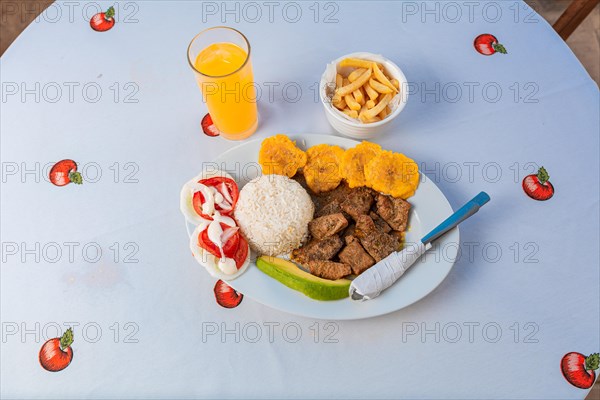 Tradicional lunch served at the table. Top view of traditional lunch with orange juice on the table