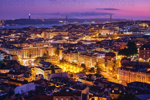 Night view of Lisbon famous view from Miradouro da Senhora do Monte tourist viewpoint of Alfama and Mauraria old city districts