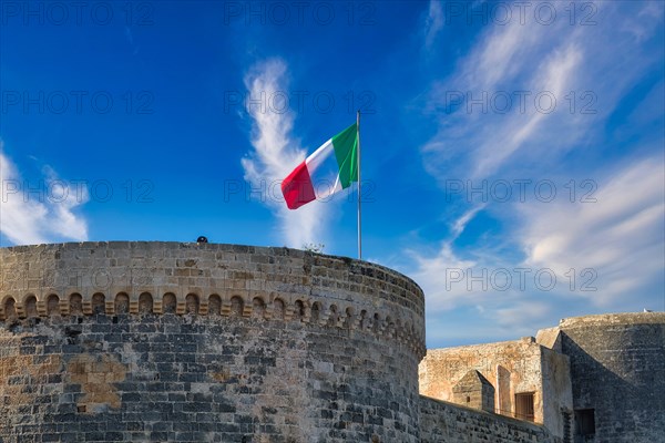 Italian flag on the Castelo in the fishing port of Gallipoli