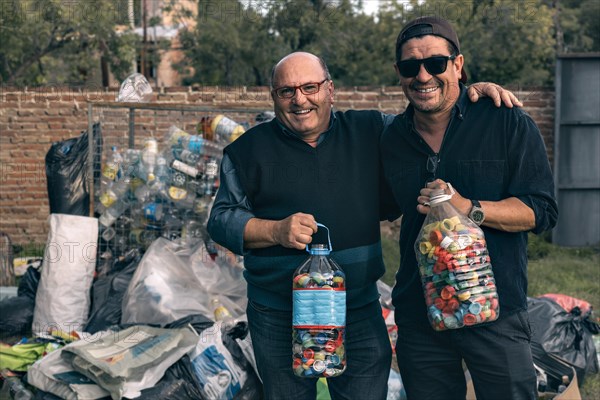 Two men at a neighborhood recycling center