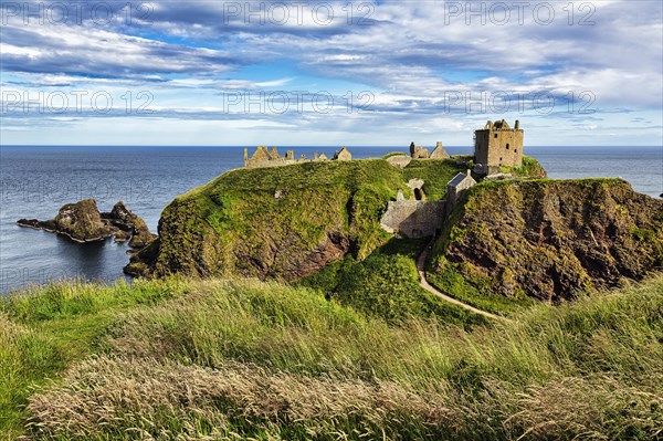 Rocky headland with castle ruins