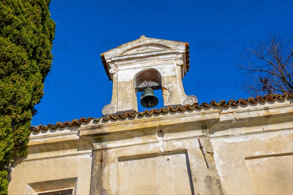 Church with Bell and a tree with Clear Blue Sky in Park San Michele in Castagnola in Lugano