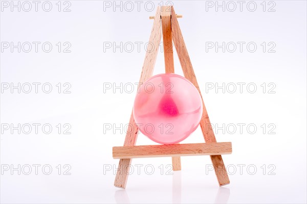 Balloon placed on a tripod for Painting on white background