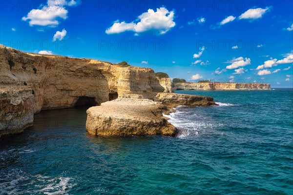 Rock stacks and crystal clear sea of the Faraglioni di Sant Andrea