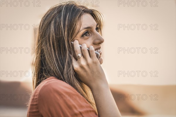Woman talking on mobile phone outdoor