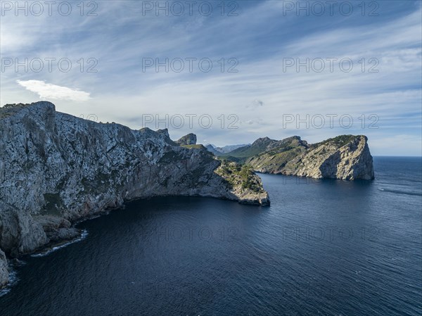 Flight past rocky cliffs and sea