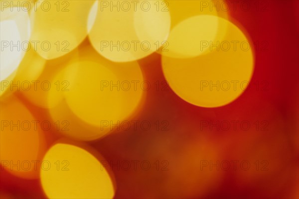 Red tone blurs the bokeh light. Defocused Red and orange holiday bokeh. Abstract christmas background