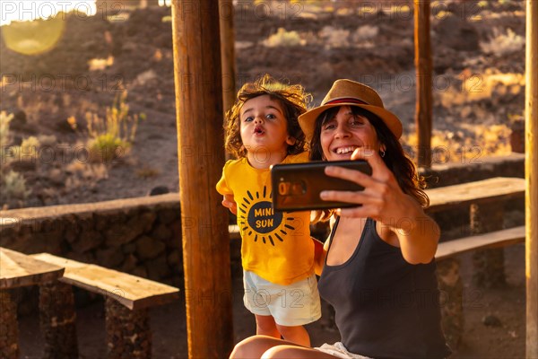 Portrait of mother and son on vacation at Tacoron beach on El Hierro