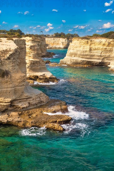 Rock stacks and crystal clear sea of the Faraglioni di Sant Andrea