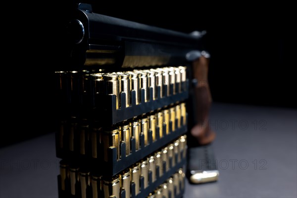 Elegant Semiautomatic 9mm Handgun Leaning on Bullet Ammunition in Switzerland